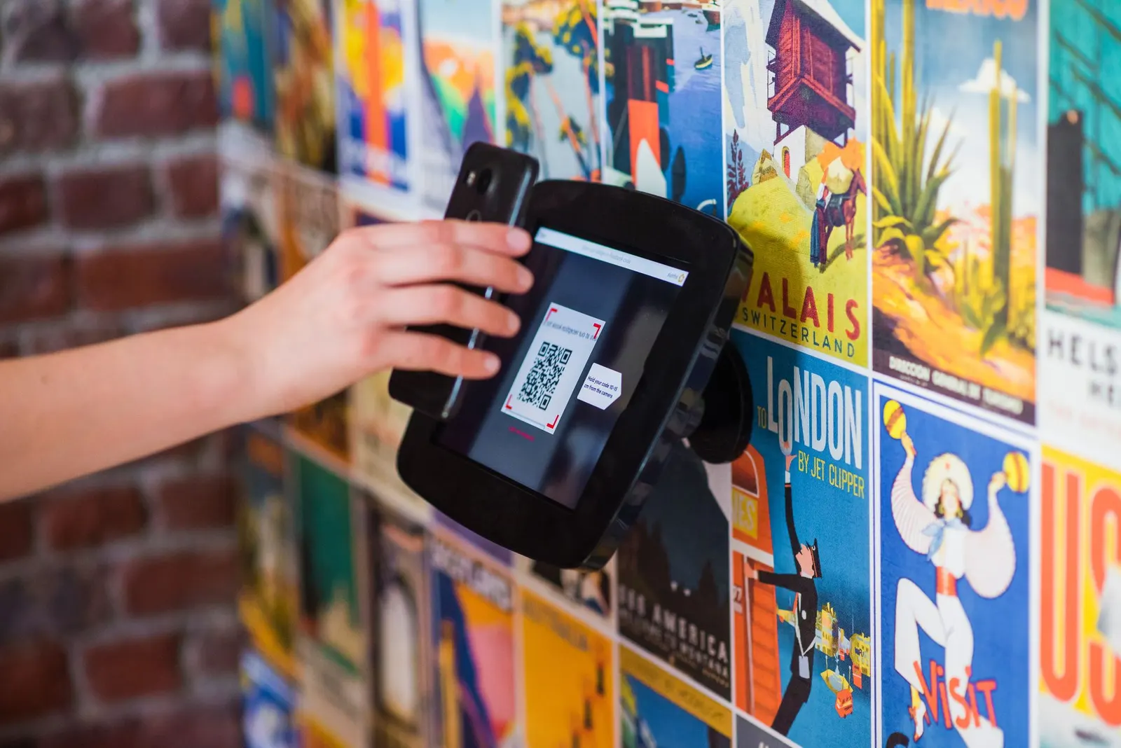 Scanning a QR code on a poster wall